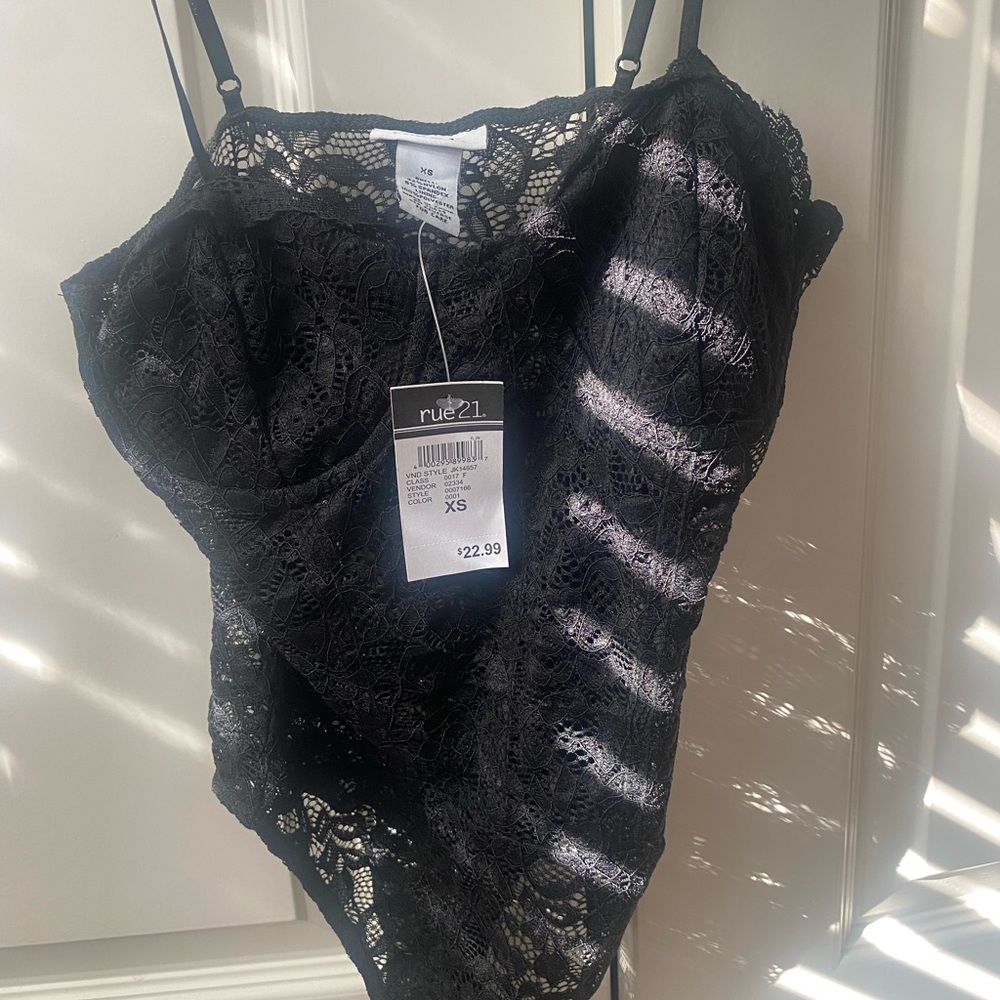 Size XS, no tears. Never worn.
